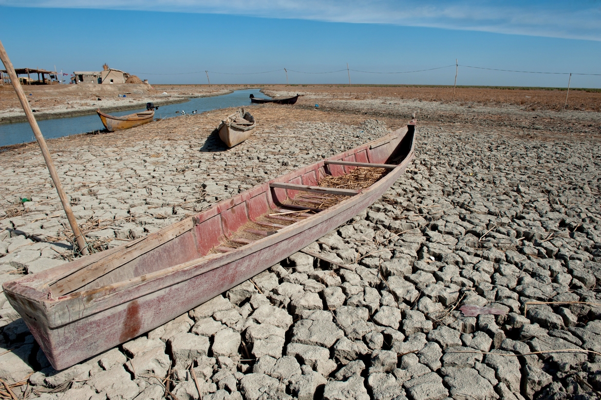 Fishing boats on dry land during the drought in Iraq. Climate change is making life difficult for local fishermen.