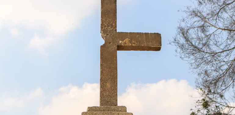 A picture of a broken stone cross.